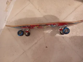 Monopatín Oxelo con diseño de mono