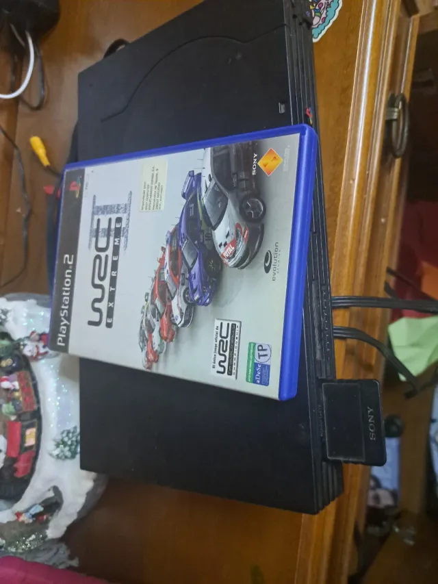 Console Playstation 2 con controller e gioco