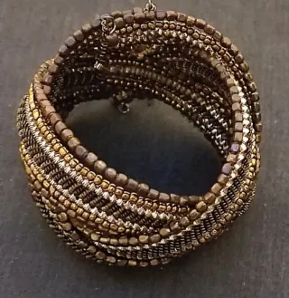 Pulsera Parfois dorada y marrón