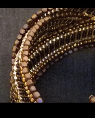 Pulsera Parfois dorada y marrón