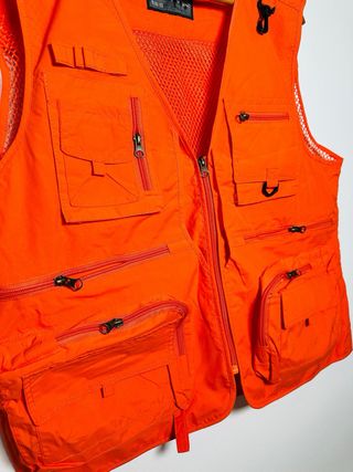 Chaleco multibolsillos naranja pesca fotografía