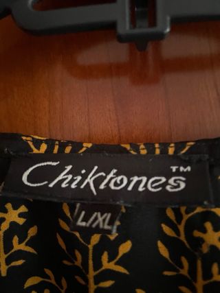 Blusa corte asiático negra y dorada