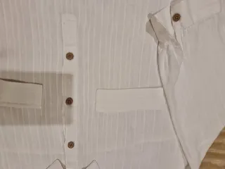 Blusón blanco de Zara.