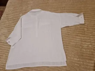 Blusón blanco de Zara.