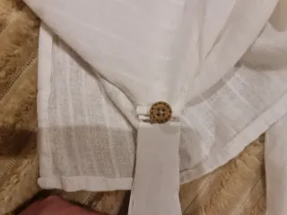 Blusón blanco de Zara.