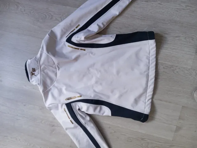 Cazadora Deportiva pádel Drop Shot Blanca y Dorada