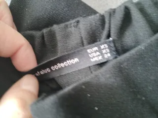 Pantalones Zara negros con raya blanca