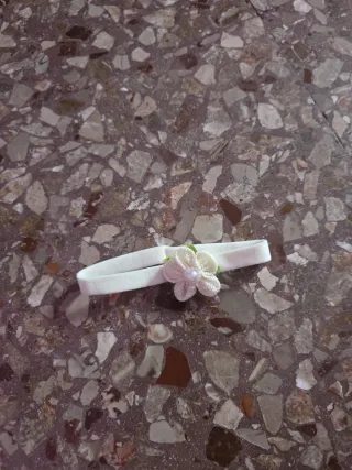 Fascia per bambola con fiorellino