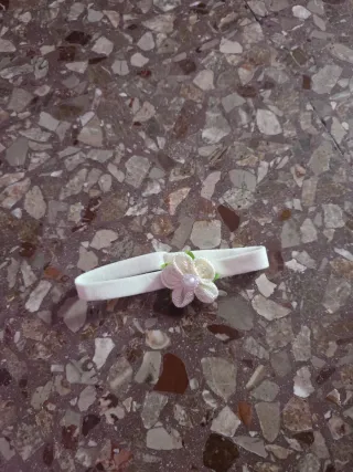 Fascia per bambola con fiorellino