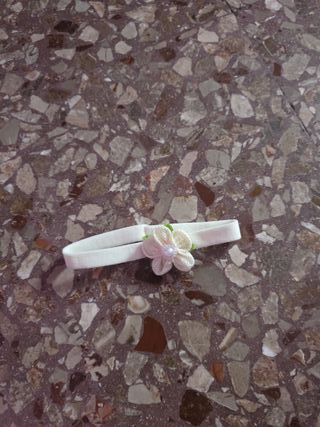 Fascia per bambola con fiorellino