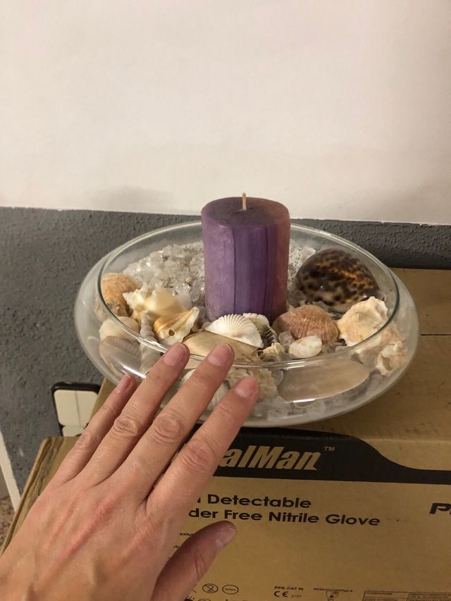 Centro de mesa con caracolas y vela