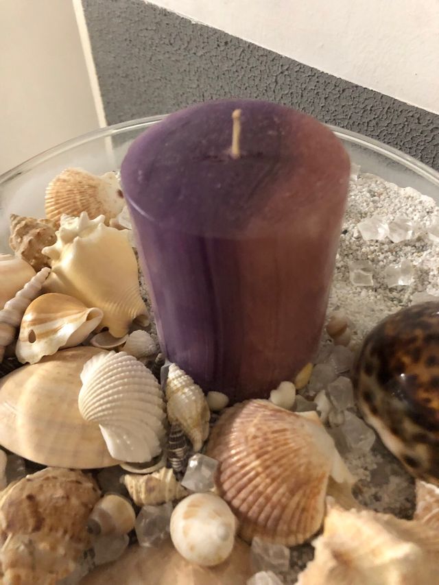 Centro de mesa con caracolas y vela