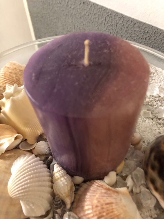 Centro de mesa con caracolas y vela