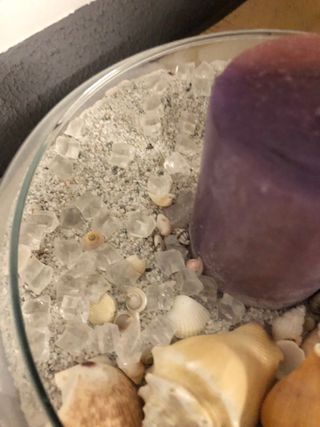 Centro de mesa con caracolas y vela