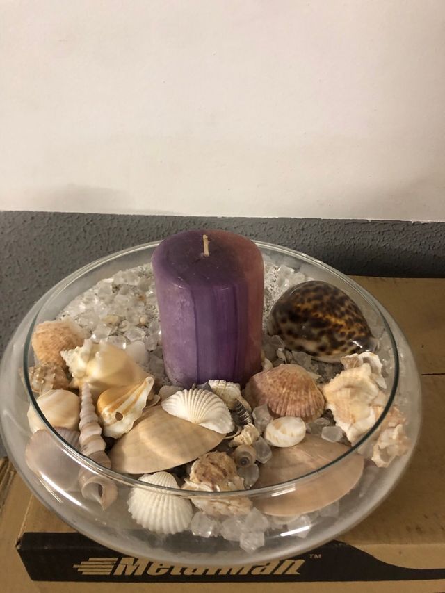Centro de mesa con caracolas y vela