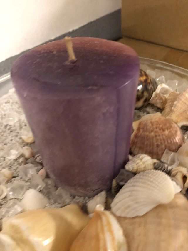 Centro de mesa con caracolas y vela