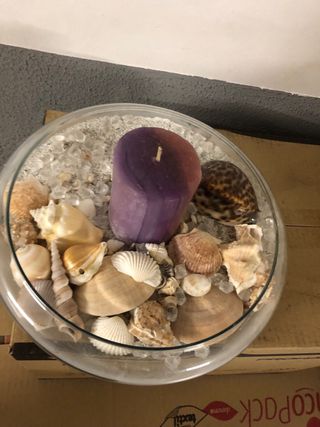 Centro de mesa con caracolas y vela