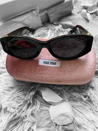 Occhiali da sole Miu Miu neri e oro