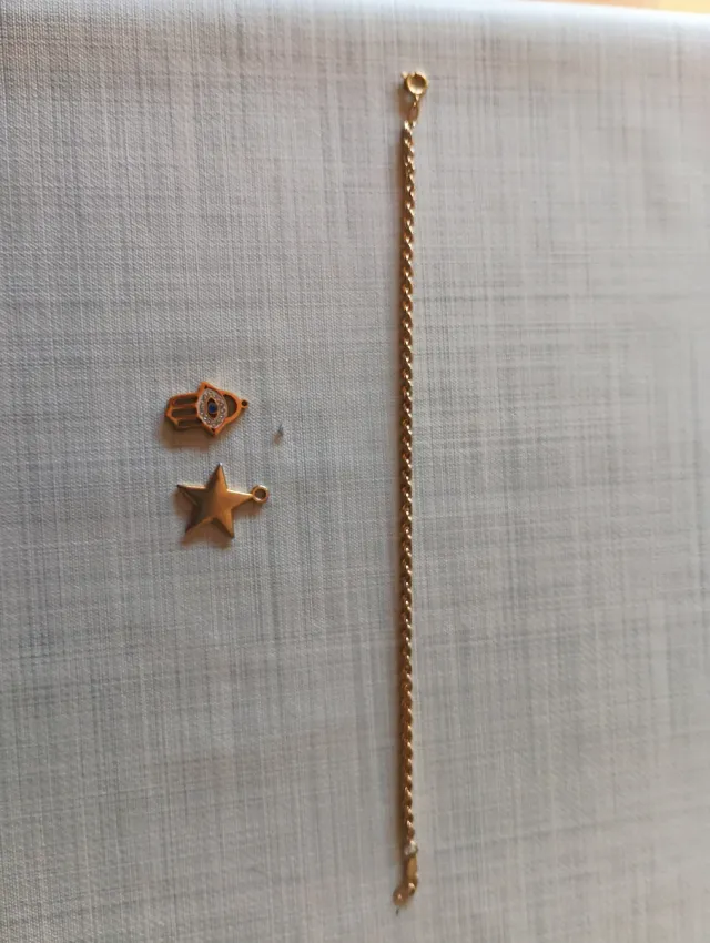 Ciondolo imitazione oro stella e mano