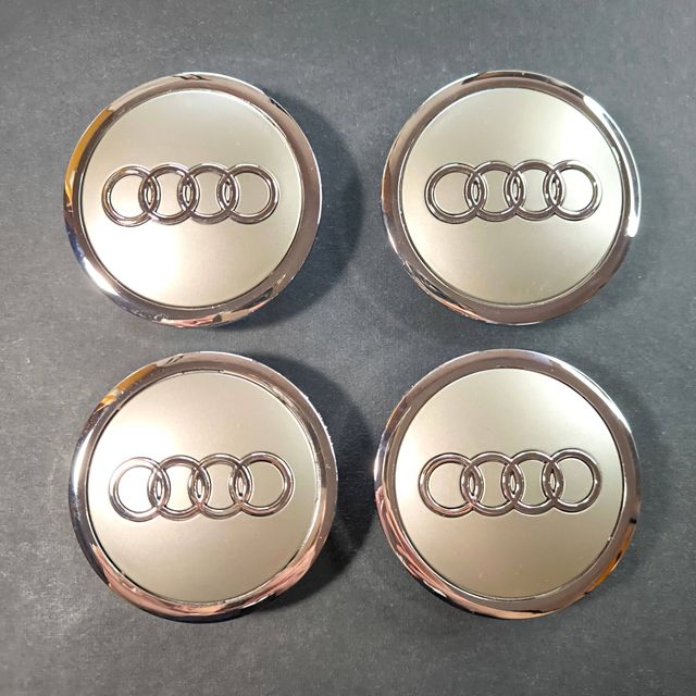 TAPABUJES AUDI 69mm GRIS · EMBLEMA LLANTAS AUDI