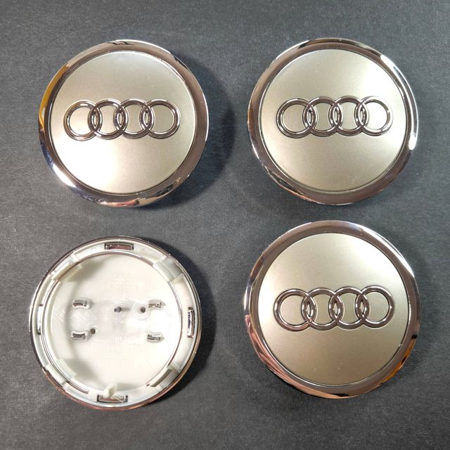 TAPABUJES AUDI 69mm GRIS · EMBLEMA LLANTAS AUDI