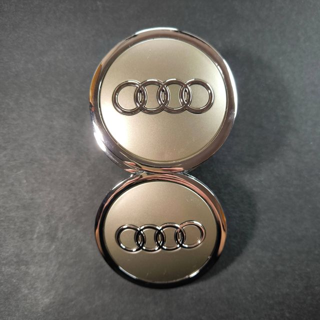 TAPABUJES AUDI 69mm GRIS · EMBLEMA LLANTAS AUDI