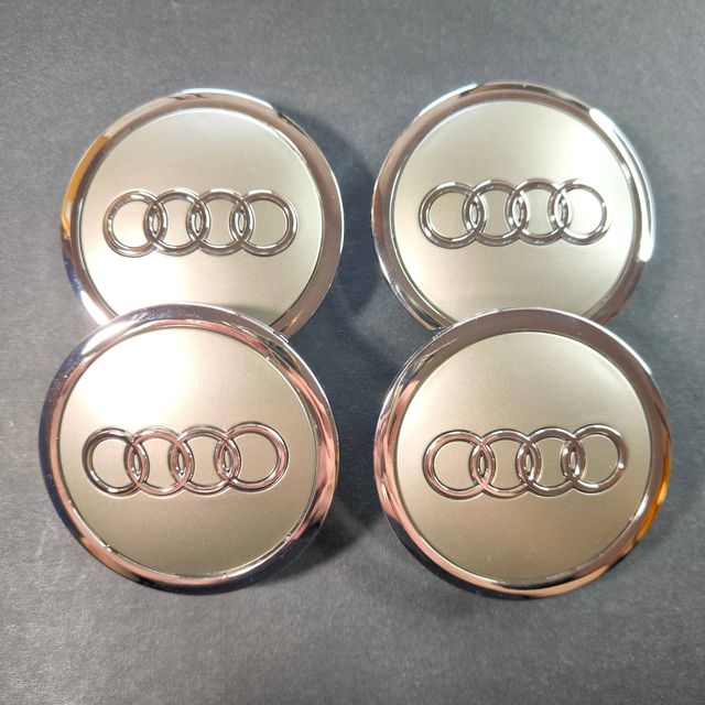 TAPABUJES AUDI 69mm GRIS · EMBLEMA LLANTAS AUDI