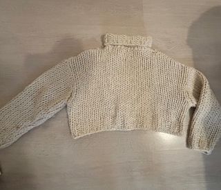 Jersey de lana beige cuello alto