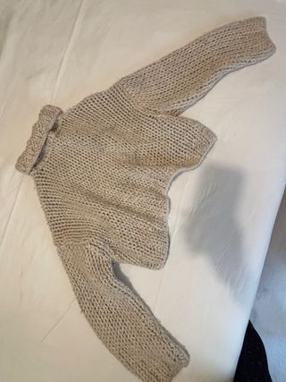 Jersey de lana beige cuello alto