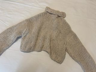 Jersey de lana beige cuello alto