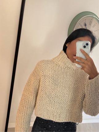 Jersey de lana beige cuello alto