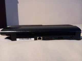 PlayStation 3 con cables, mando y 4 juegos