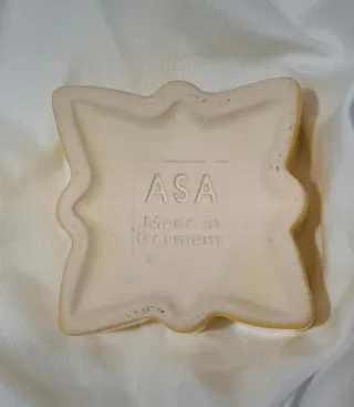 Portacandela a forma di stella in ceramica gialla