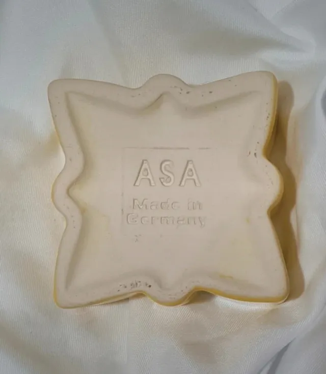 Portacandela a forma di stella in ceramica gialla