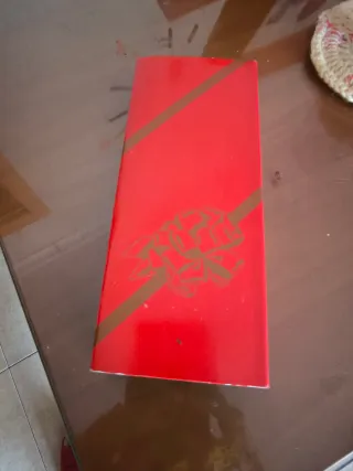 Colgante color oro con circonita.