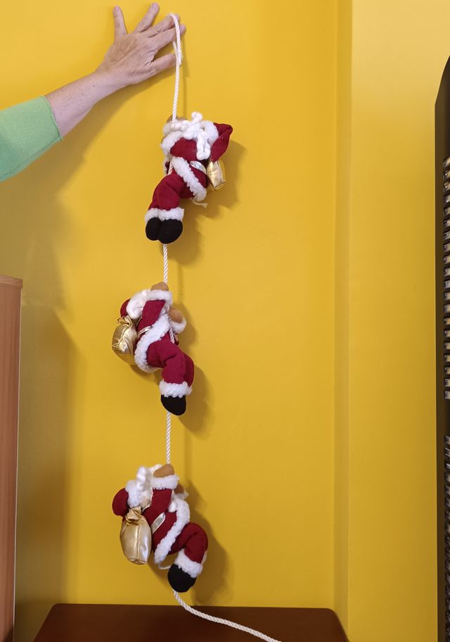 Papá Noeles trepadores por cuerda