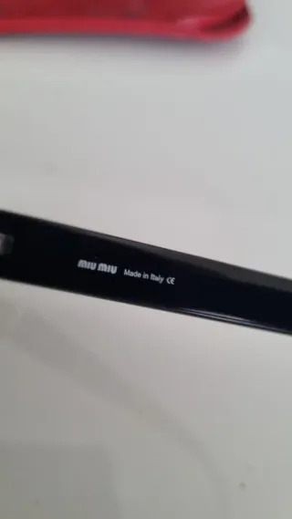 Occhiali da sole Miu Miu SMU04A neri