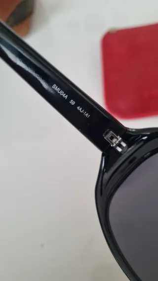 Occhiali da sole Miu Miu SMU04A neri