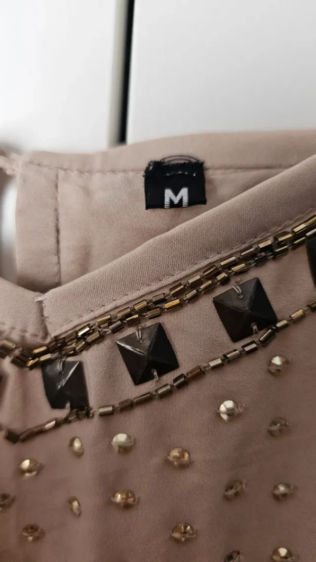 Mono corto Faust con pedrería