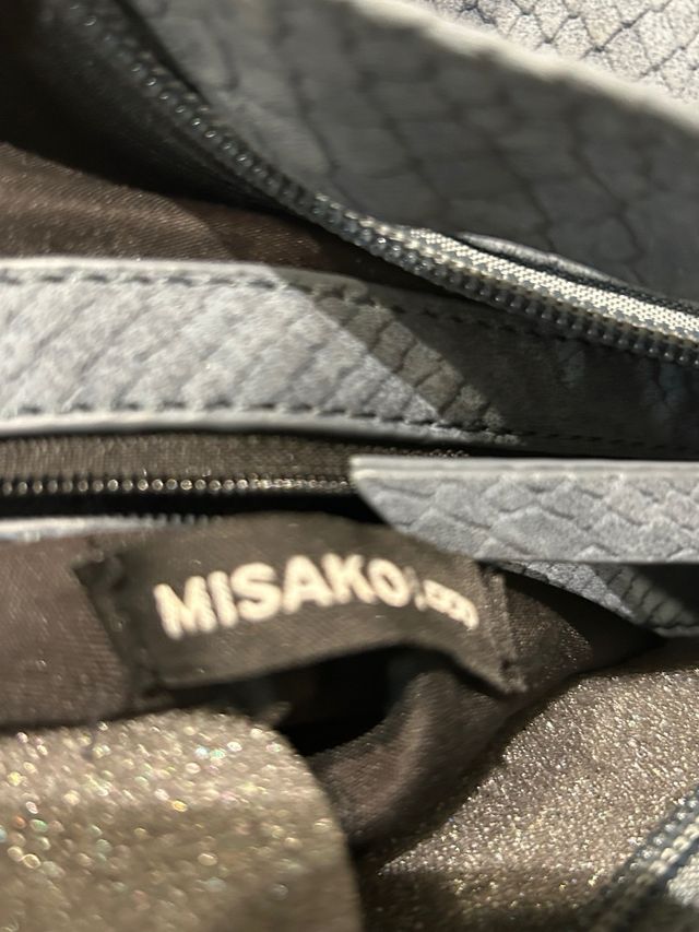 Mochila azul claro con estampado de serpiente