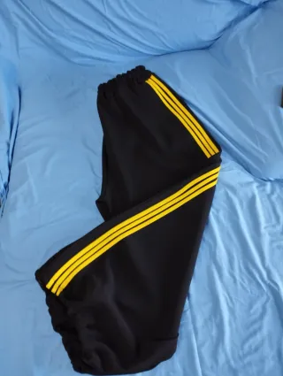 Pantaloni donna over neri con righe gialle