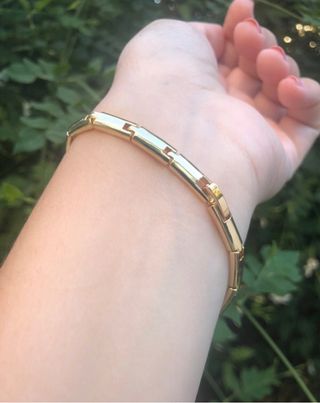 Pulsera dorada con panteras brillantes