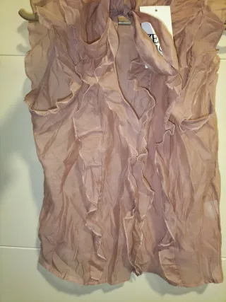 Blusa sin mangas con volantes y lazo