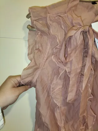 Blusa sin mangas con volantes y lazo