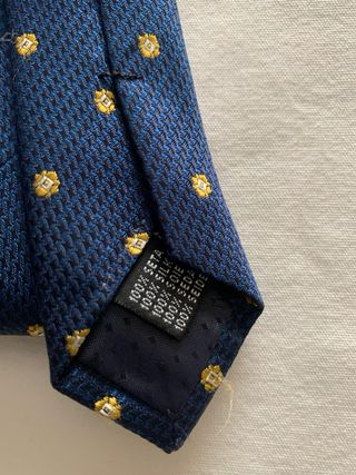 Corbata John Tweed azul con topos dorados