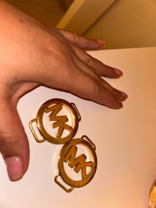 Chapas Michael Kors Doradas