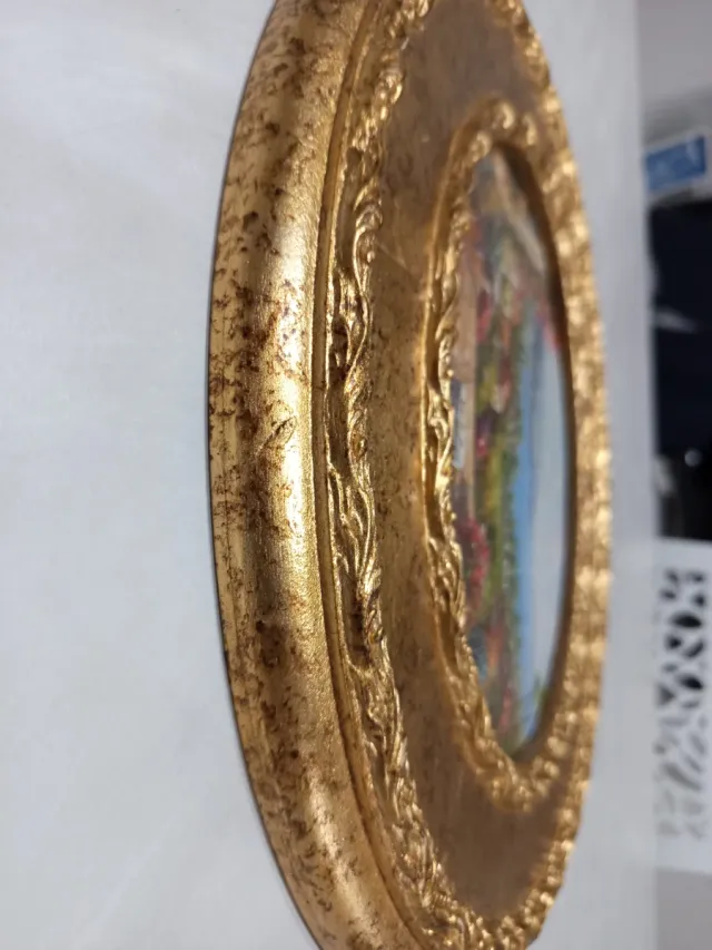 Quadro paesaggistico ovale dorato