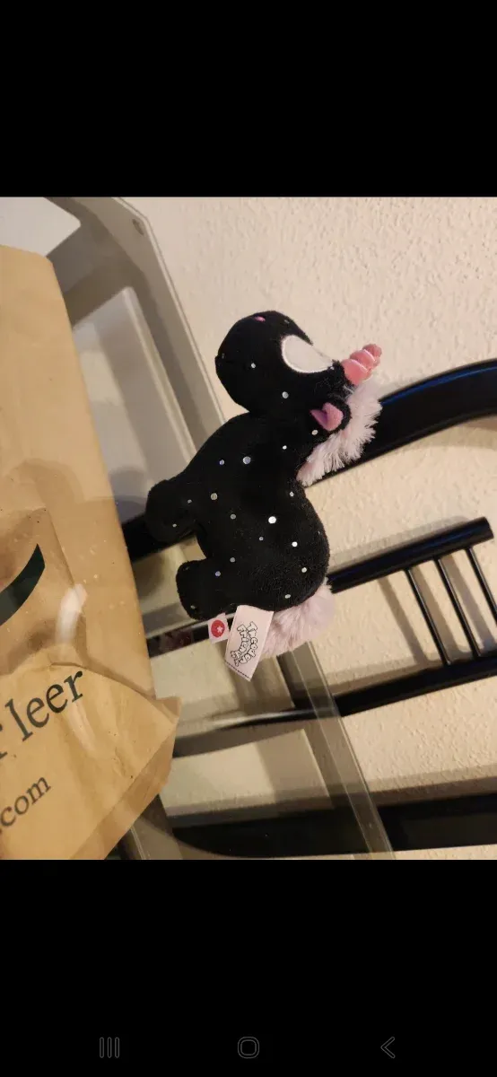 Peluche unicornio negro con estrellas