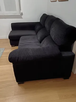 Sofá cama modular negro de tela.