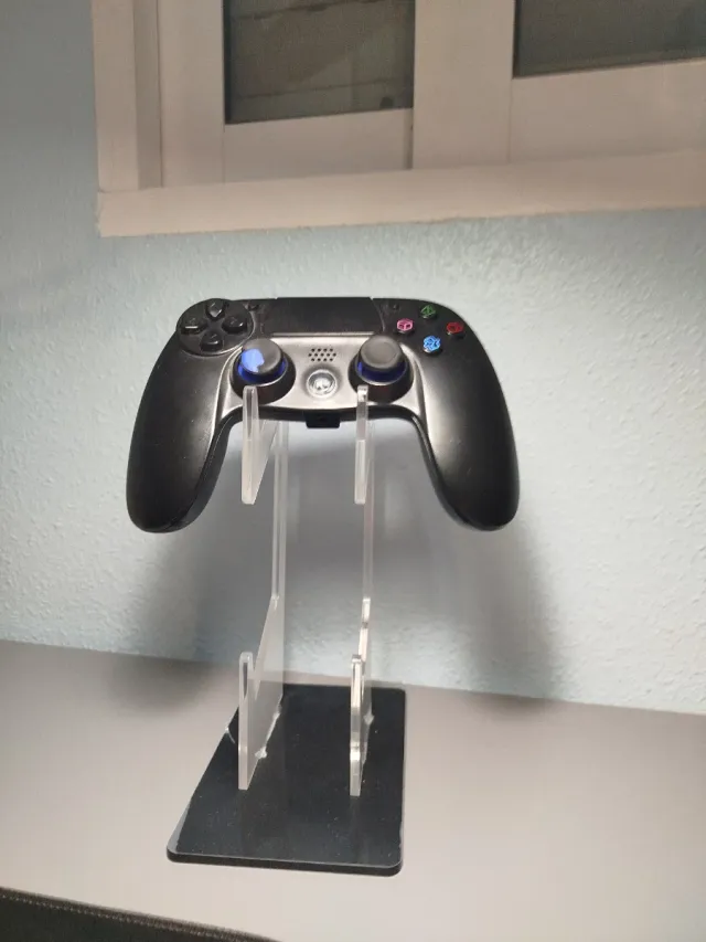 Soporte acrílico para mando de consola